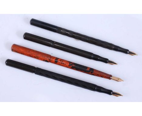 Four vintage Onoto De La Rue hard rubber fountain pens, two being in chased black, one being red ripple 'The Pen', and the la