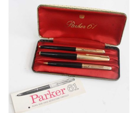 A cased Parker 61 fountain pen, ballpoint pen and mechanical pencil set, in black with gold trim, the caps all marked PARKER 