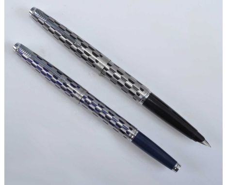Two Parker Harlequin pens, one being a Black Shield fountain pen, the cap with arrow clip and engraved PARKER MADE IN ENGLAND