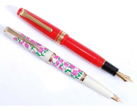 Two Japanese fountain pens by Sailor, one being a 1911 Professional Gear Slim / Sapporo in Persimmon with gold plated trim, t