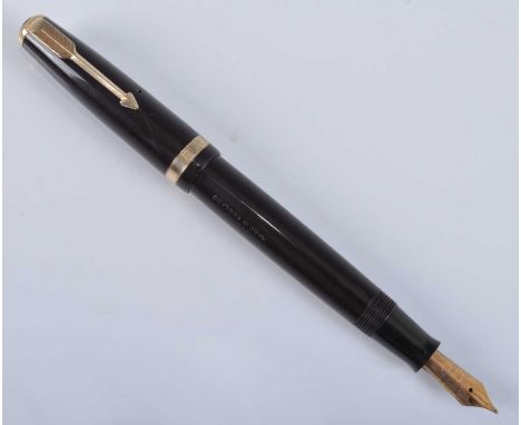 A Parker 35 Duofold fountain pen, in dark brown with gold trim, the barrel engraved PARKER DUOFOLD REG T.N. MADE IN ENGLAND, 