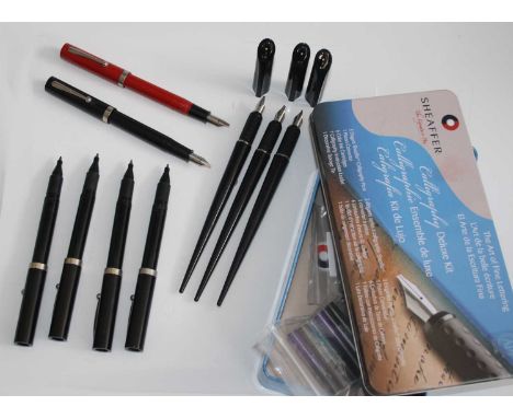 A part Sheaffer Calligraphy Deluxe kit in tin, comprising three tapering calligraphy pens (B 0.07, F 0.03, M 0.05), cartridge