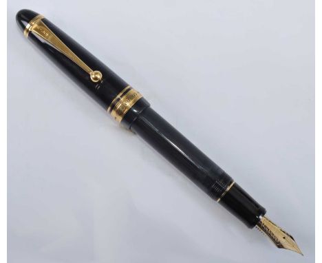 A Pilot Custom 823 fountain pen, in black with gold trim, having semi-translucent barrel, the nib engraved PILOT 14K 585 15 &
