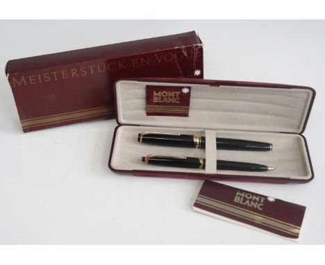 A cased Montblanc Meisterstuck No.14 'En Vogue' fountain pen and pencil set, 1960s, in black with gold trim, having hooded ni