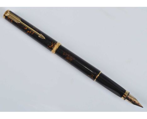 A Parker Premier Chinese Laque fountain pen, with gold trim, the nib engraved PARKER 750M 18K FRANCE, the cap band engraved P