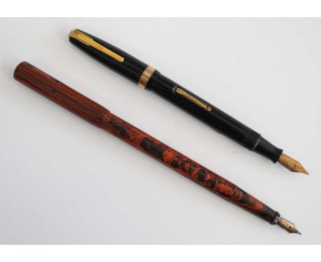A boxed Watermans 515 fountain pen, in black with gold filled trim, the barrel engraved Waterman's Made in England 515 and wi