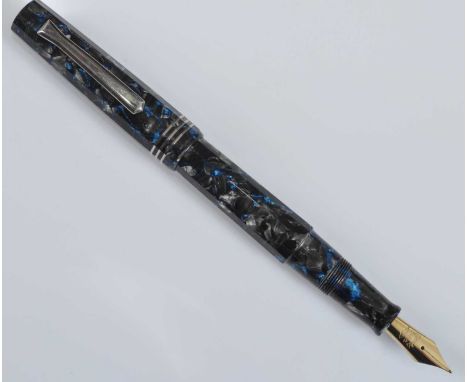 A cased Tibaldi Impero fountain pen, in silver-grey flake faceted celluloid with electric blue detail and silver trim, the br