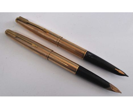 Two Parker fountain pens in lined rolled gold, one being a 61 marked Parker Made in England to the cap and inset gold arrow t