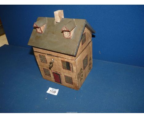 An interesting Tea Caddy in the form of a painted house, with key, 8'' high.
