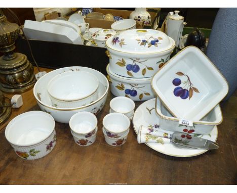 A quantity of Royal Worcester 'Evesham' including lidded tureens, ramekins, cake plate and slices, fruit bowl etc plus two sq