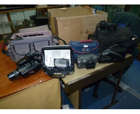 Four Video Cameras - A Hitachi DZ-MV3000E mini DVD and SD Card Digital Video Camera with Hitachi Carry Case, a Canon UC-X30 H