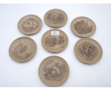 Seven Poole Pottery animal plates.