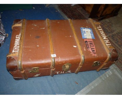 A bentwood bound Steamer Trunk with some travel labels, 35'' x 20'' x 12''.