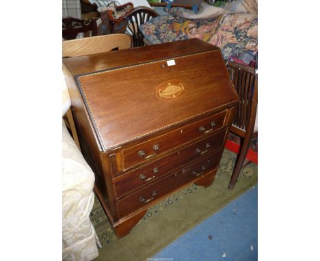 An earlier 20th c. Mahogany Bureau of small dimensions having light and darkwood beading, the slope with an inlaid depiction 