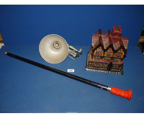 An Industrial workshop light, red Dragon head cane and a matchstick model of The Old House, Hereford.