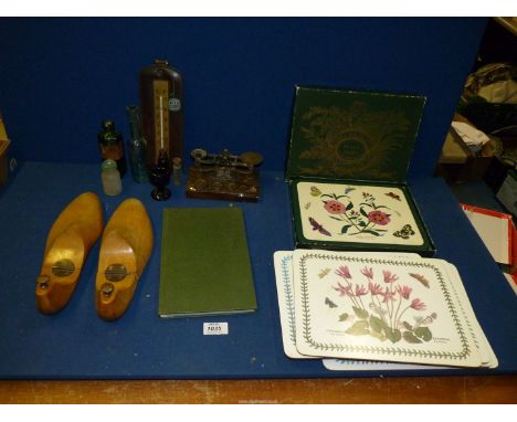 Two sets of Portmeirion placemats, small bottles, thermometer, small scales, flower book, two brass nutcrackers etc.