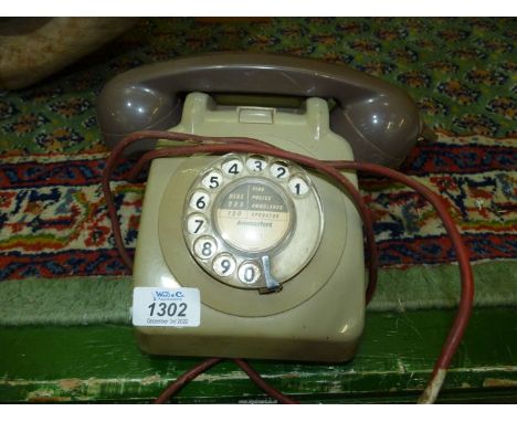 A vintage grey telephone