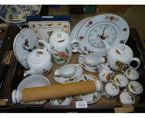 A quantity of Royal Worcester 'Evesham' including two teapots, coffee pot, chocolate cups, wall clocks, rolling pin etc.