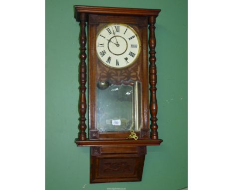 An early 20th c. Vienna type Wall Clock, in Mahogany/Walnut with a lower panel decorated with a stylised flower, the painted 