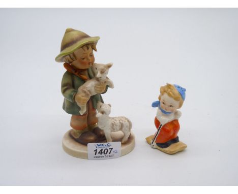 Two Hummel figures to include; a Shepherd with two lambs and a salt cellar in the form of girl skiing.