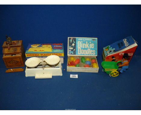 A quantity of vintage plastic toys including Charlie's Wheelbarrow, Dinkie Doodles, Little Cookie plastic scales with weights