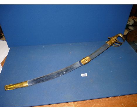 A decorative Indian Sword with steel blade, brass grip and scabbard