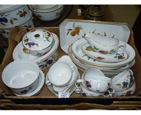 A large quantity of Royal Worcester 'Evesham' dinner ware including lidded tureen, serving dishes, soup coups, gravy boat and