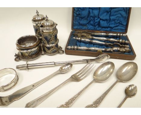 A three-piece silver and Doulton Lambeth stoneware condiment set on a non-matching Mappin & Webb silver stand, 5.4ozs (stand 