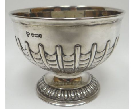 A circular-based silver bowl with gadrooned foot and raised fish-scale decoration to the body, Sheffield 1902, 4.69 ozs