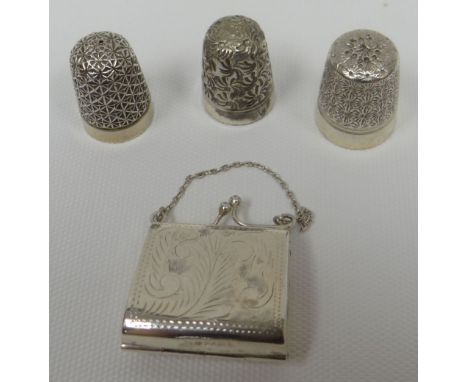 A bright-cut Sterling silver stamp-case in the form of a miniature handbag; together with three silver thimbles