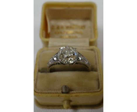 A fine antique round-cut diamond ring, the raised centre stone in a six claw setting and of an ideal/deep cut, approx. 2cts v