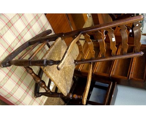 An 18th/19th Century ladder back rush seated rocking chair.