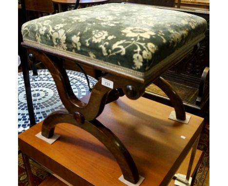 A 19th Century mahogany framed piano stool with tapestry seat.