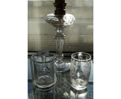 A collection of 19th Century and later glassware to include an oil lamp with internal twist stem, a tankard entitled Harriet 