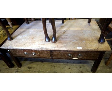 An early 20th Century oak coffee table having two base drawers.