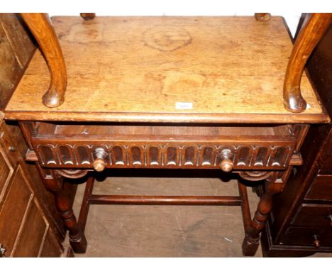 A mid 20th Century oak Jacobean revival hall table having single base drawer.