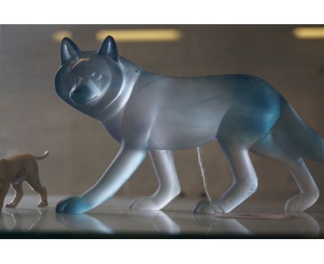 A Daum glass model of a lion Finished in a matted blue colourway, signed to leg, length 17cm, complete with original box.