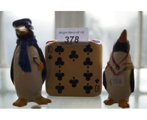 A pair of unusual Wade pepperettes in the form of penguins, together with a Carltonware ashtray.