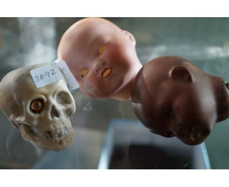A mixed group of ceramic dolls heads to include an A M of Germany example and a further Heubash-Copp German example and a cer
