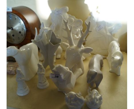 Fourteen pieces of white glazed ceramics to include a stags head, a model of a bulldog, etc.