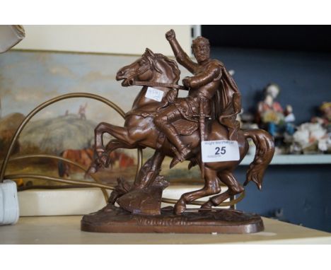 A bronzed spelter model depicting a figure on horseback.