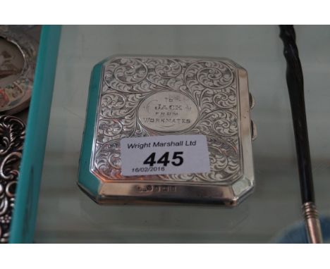 A Birmingham hallmarked silver cigarette case having engine turned decoration with faux tortoise shell interior.