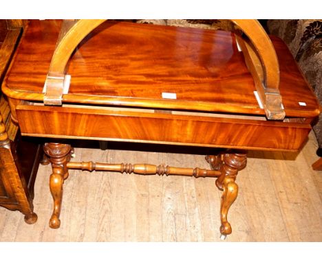 A Victorian flame mahogany console table having secret single frieze drawer raised on out swept supports.