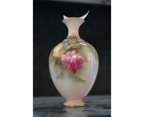 A Royal Worcester miniature vase decorated with roses and a butterfly.