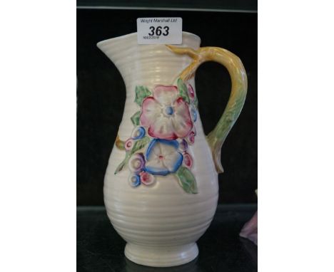 A Clarice Cliff jug decorated in the My Garden pattern.