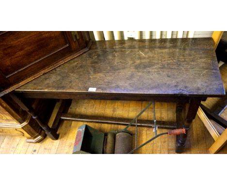 An 18th Century and later oak console table, raised on block supports.  