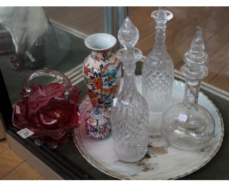 A mixed group of ceramics and glassware to include a Cranberry glass loop handled bowl and further dish, a pair of tall glass