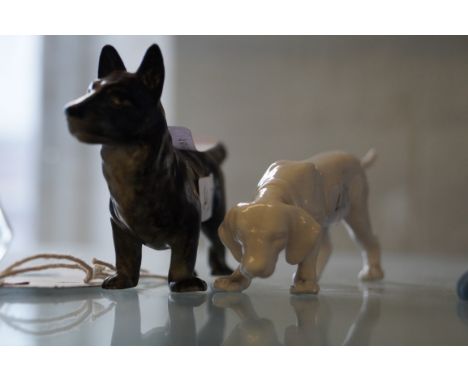 Two Baccarat crystal models of a hunting dogs Decorated in a clear colourway, signed to foot, height 12cm, length 18cm, compl