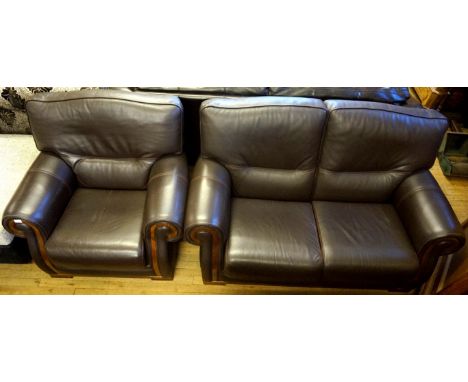 A reproduction Ferrari Divani Italian brown leather two seater sofa and matching armchair.