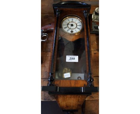 A late 19th Century miniature Vienna regulator sample wall clock with enamel dial.